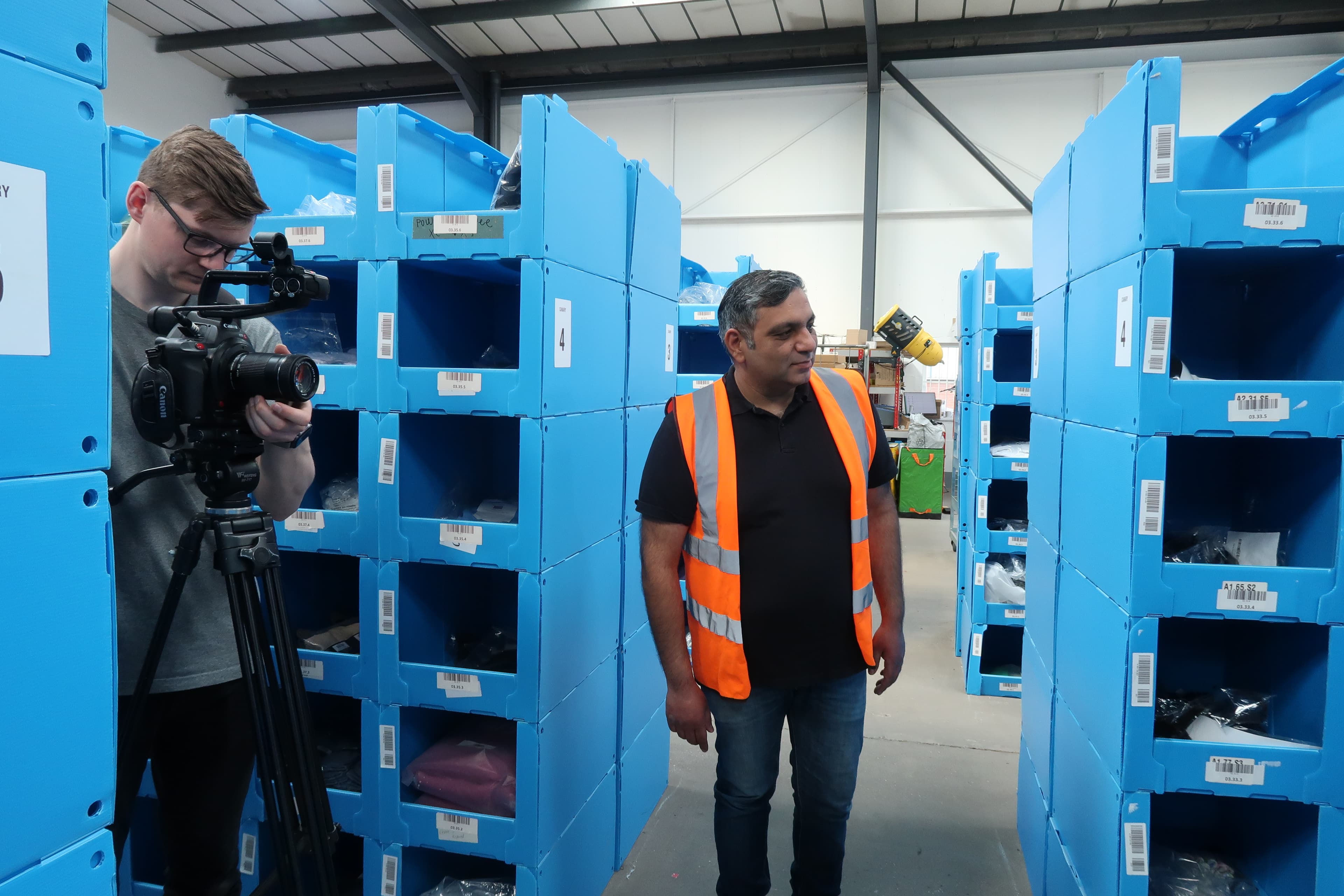 Rapid Pack team filming and reviewing warehouse picking locations