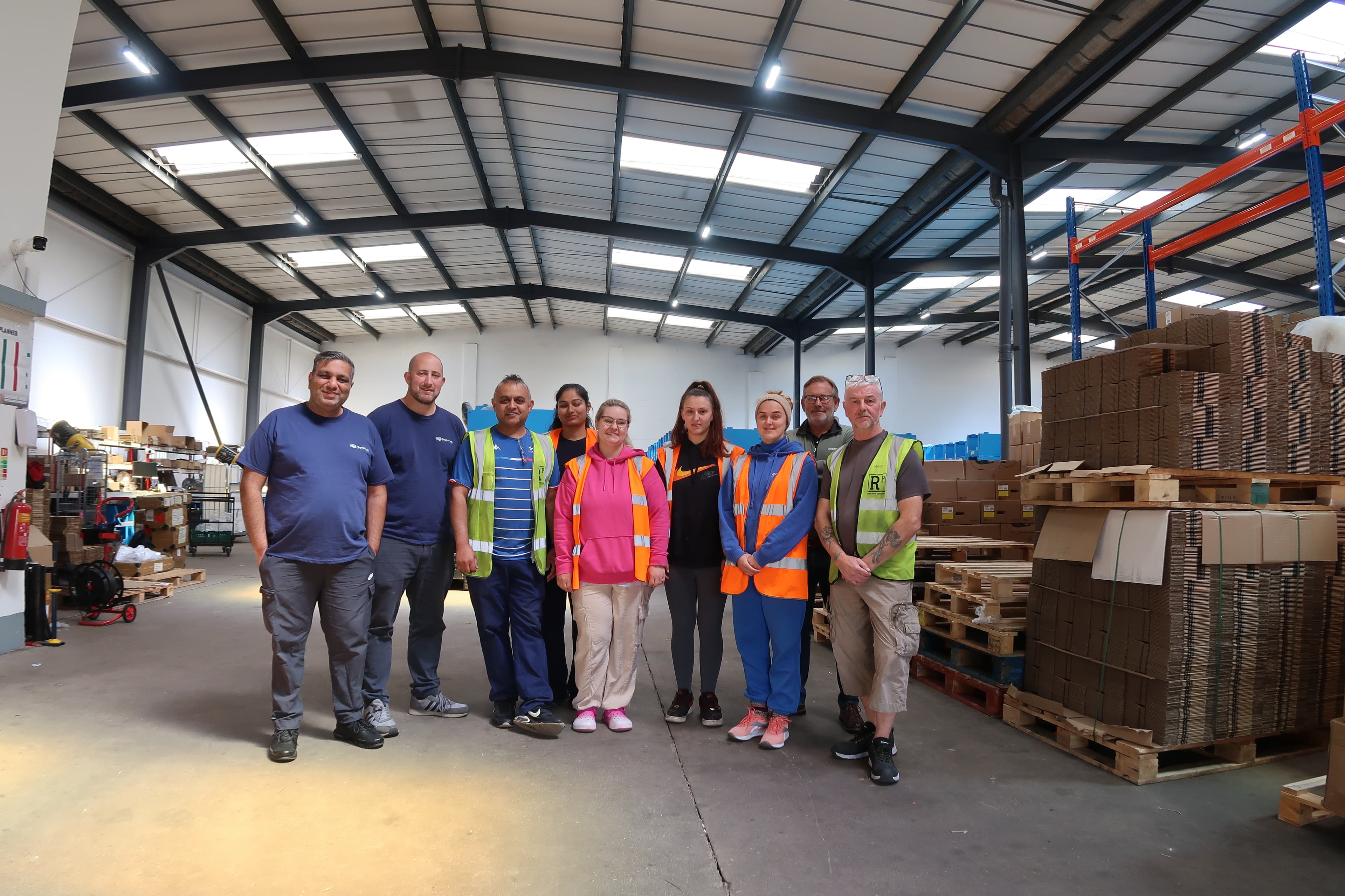 Rapid Pack warehouse team standing together inside the Oldbury fulfilment operation